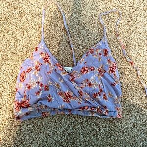 Women’s crop top with around the neck tie. Brand is American Eagle. Size Medium.